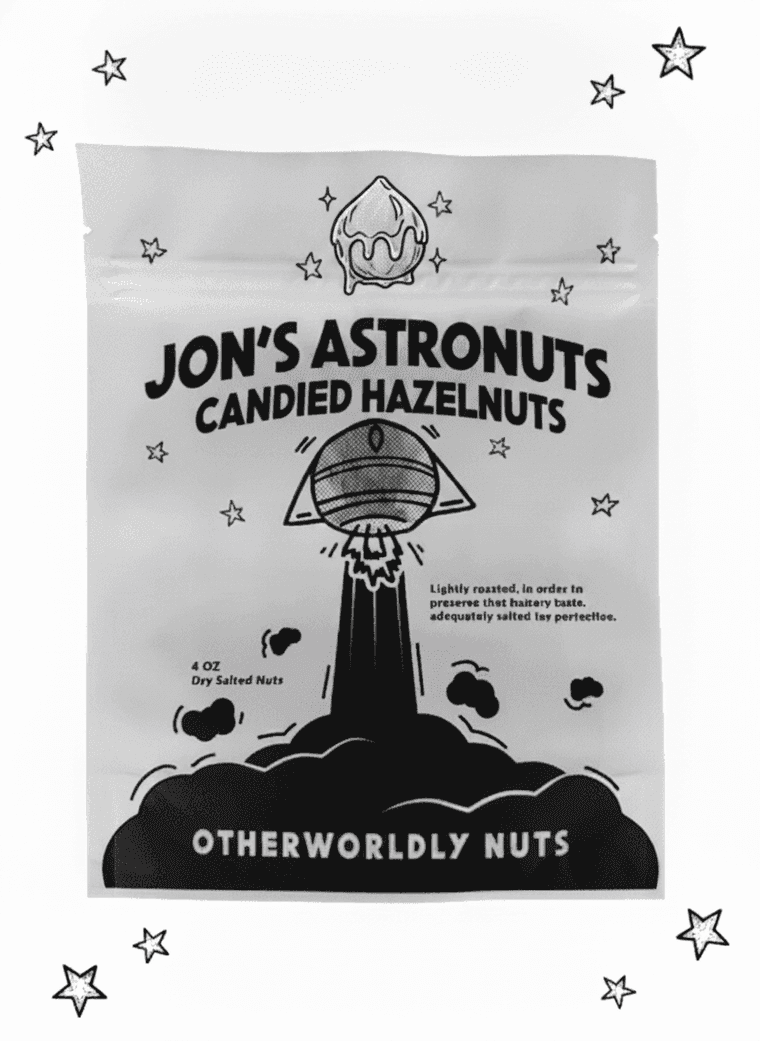 Jon's Astronuts candied hazelnuts pouch — black-and-white, glazed nut on the rocket